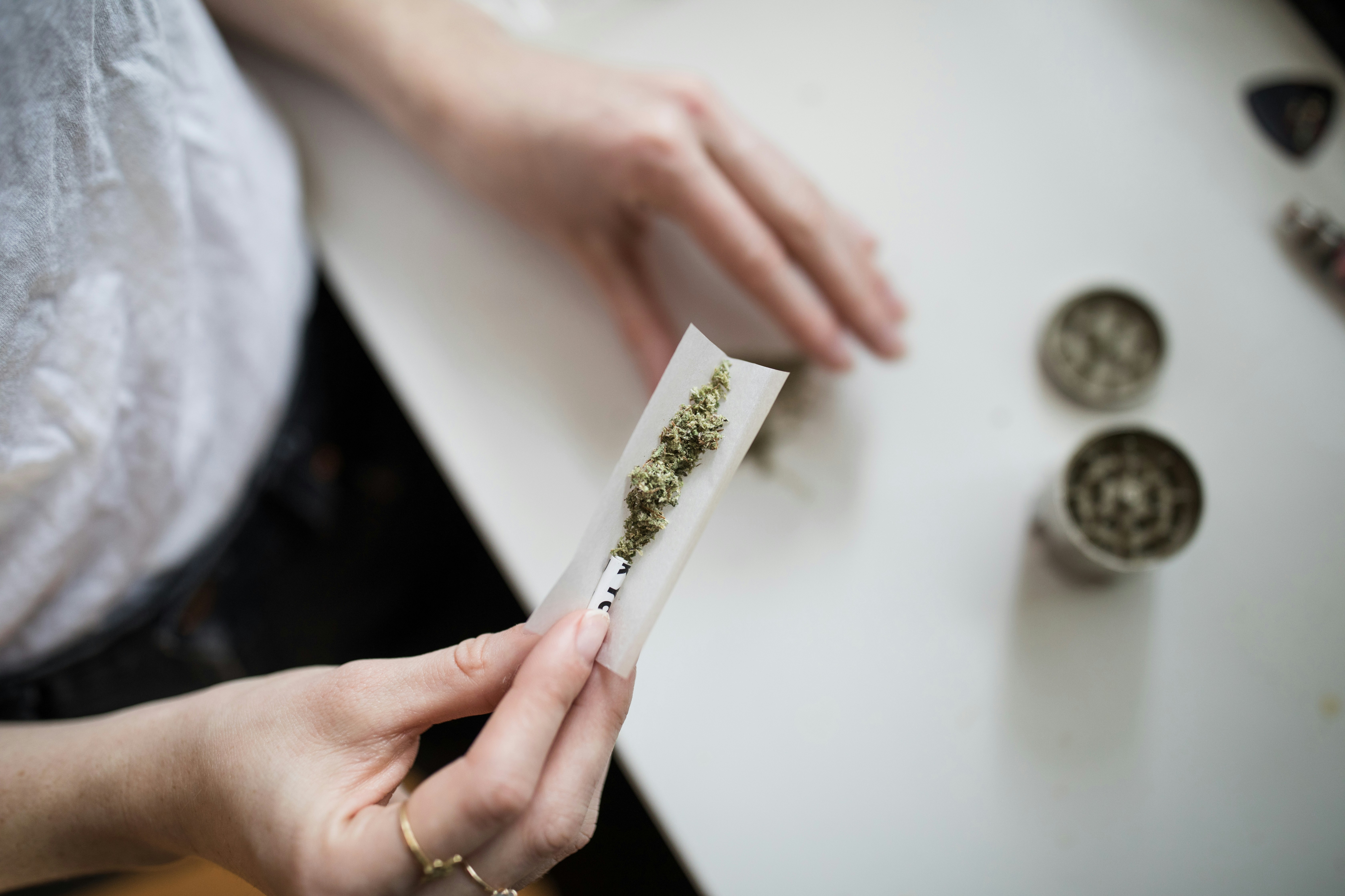 Person preparing to smoke marijuana